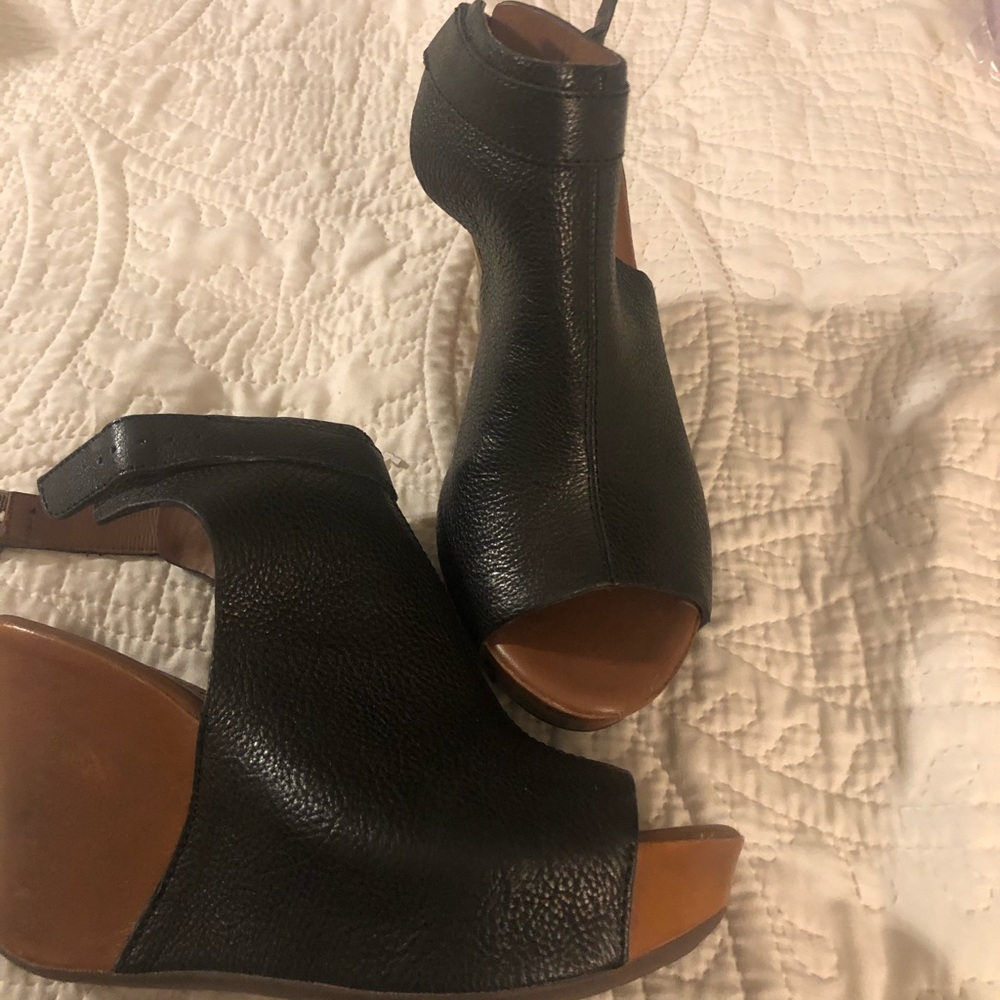 Wedges. Black top and brown bottom wedges.